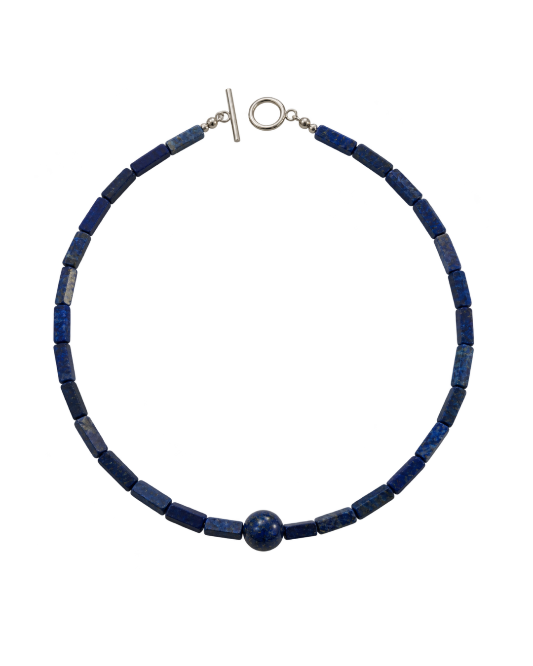 A beaded necklace made of dark blue lapis lazuli cube beads with a single round blue bead at the front, finished with a silver-tone toggle clasp and ring clasp, shown on a plain white background.