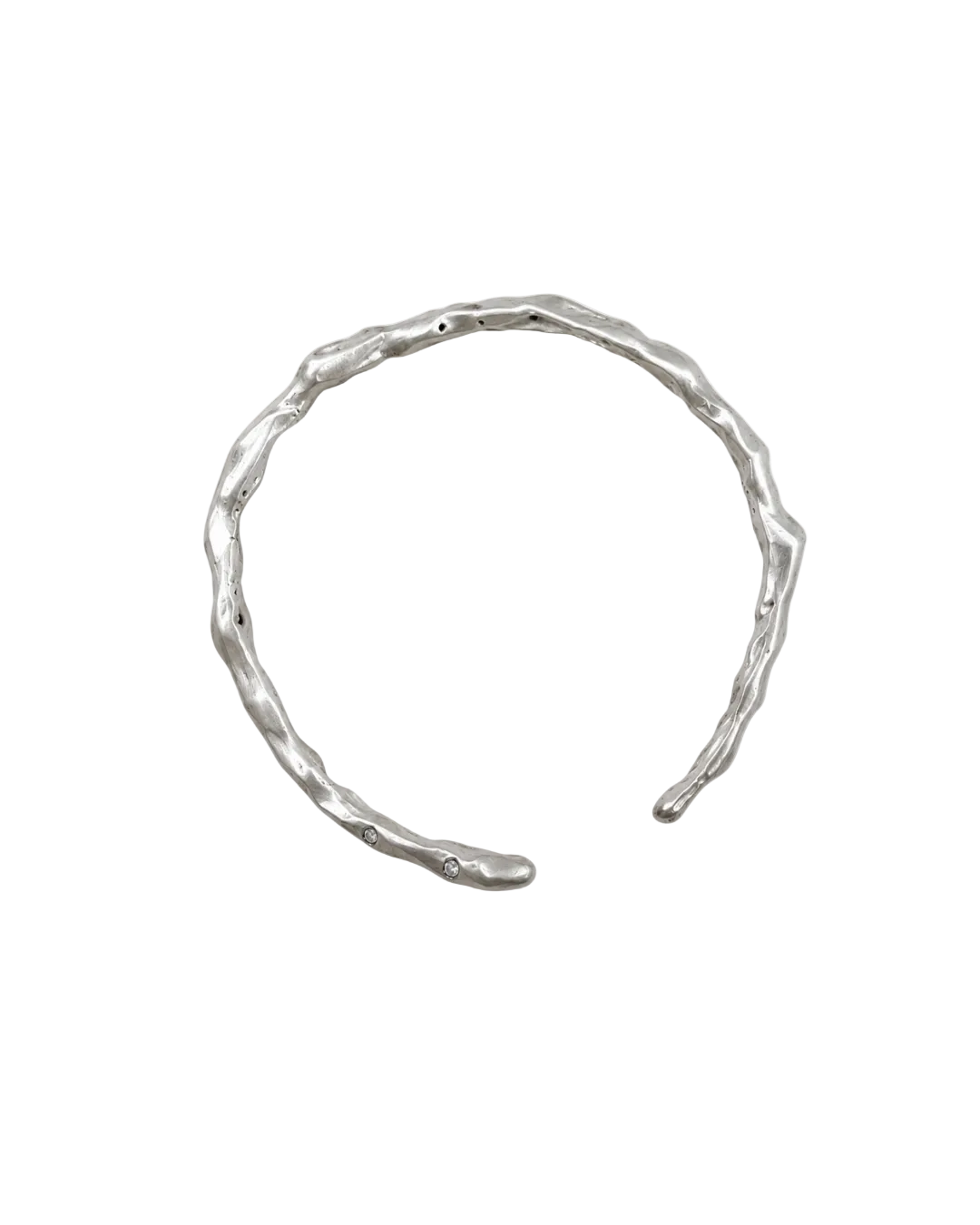 A textured, organic-shaped silver cuff bracelet on a plain white background.