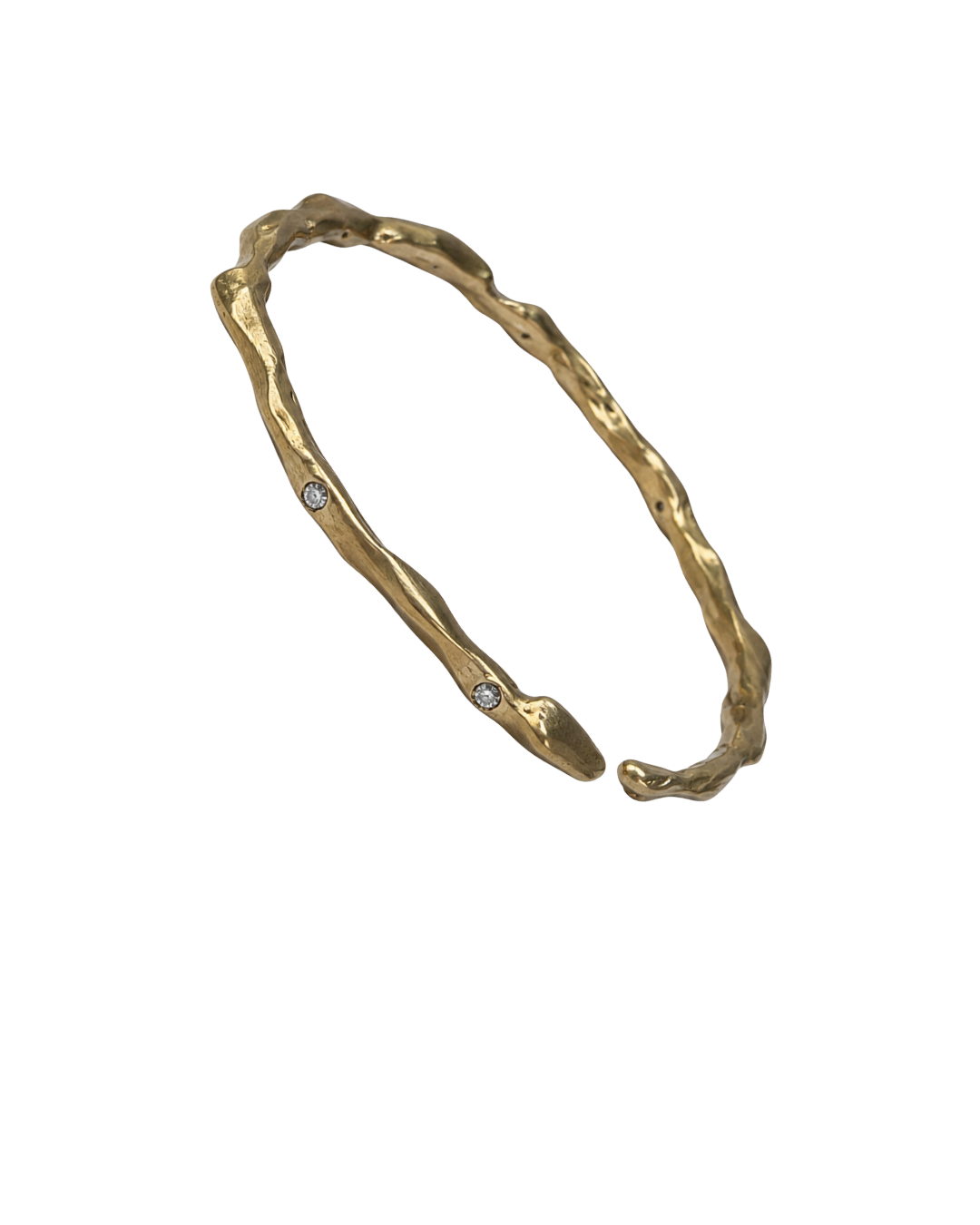 A gold-toned, organic-shaped cuff bracelet with three small, round clear gemstones set along the front, displayed on a solid white background.